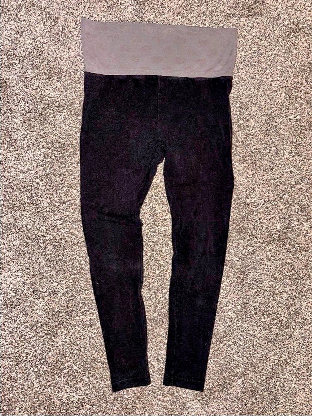 Black Y2K yoga pants with a grey waistband with subtle heart design